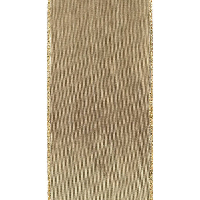Four-inch velvet ribbon with alternating gold and ivory harlequin diamonds, arranged in loose loops beside a spool on a white background.