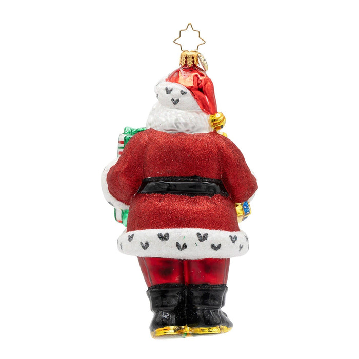 Christopher Radko Jingle & Jolly handcrafted glass Christmas ornament featuring Santa Claus in a red suit with wrapped gifts, peppermint-striped trousers, and glittered holiday details.