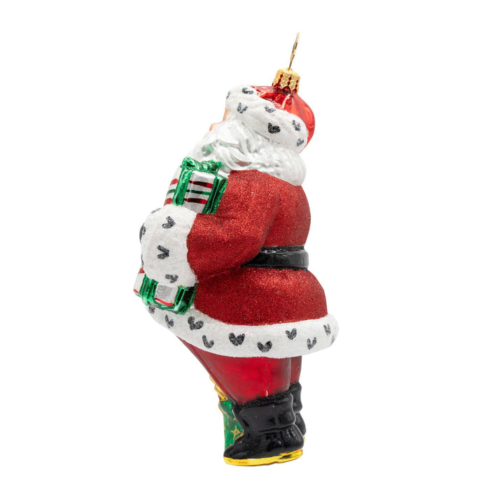 Decorative Christmas ornament of a stylized Santa Claus figure on a white background
