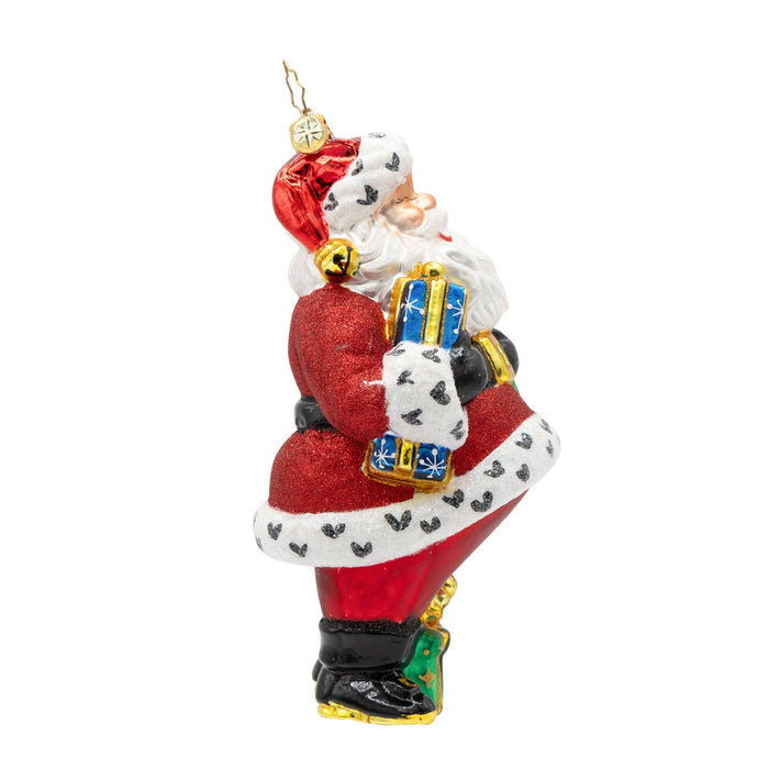 Decorative Christmas ornament of a stylized Santa Claus figure on a white background