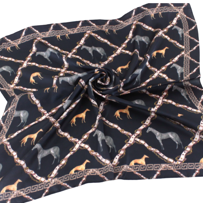Black square scarf with horses, hounds, and a rope-like lattice pattern in warm gold and neutral tones.