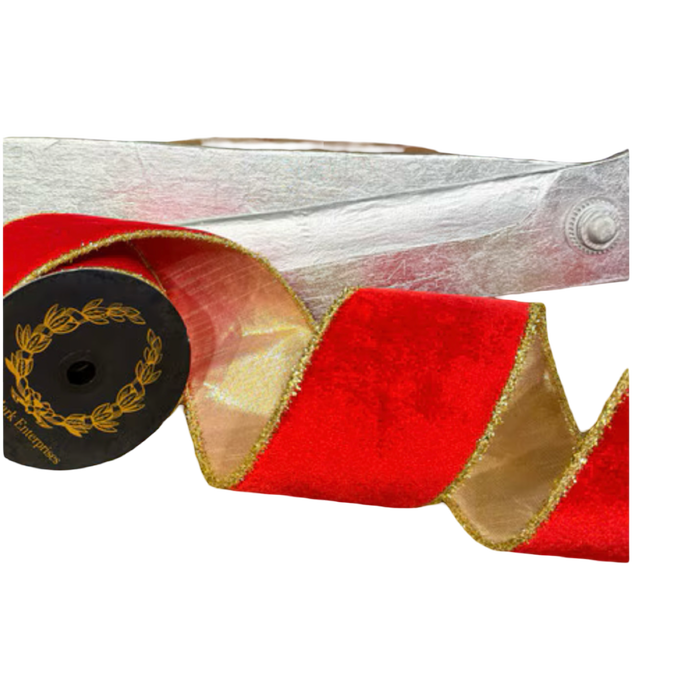 JME 4-inch red velvet ribbon with gold tinsel edges, curled beside a black spool to reveal its metallic gold reverse.
