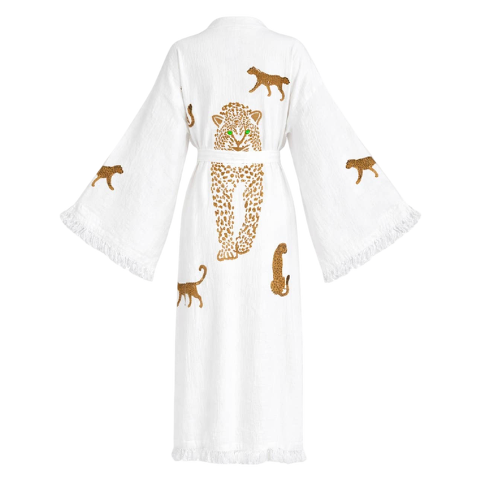 A white cotton kimono robe with wide sleeves and fringed edges, featuring embroidered leopard designs in brown and gold on the back.
