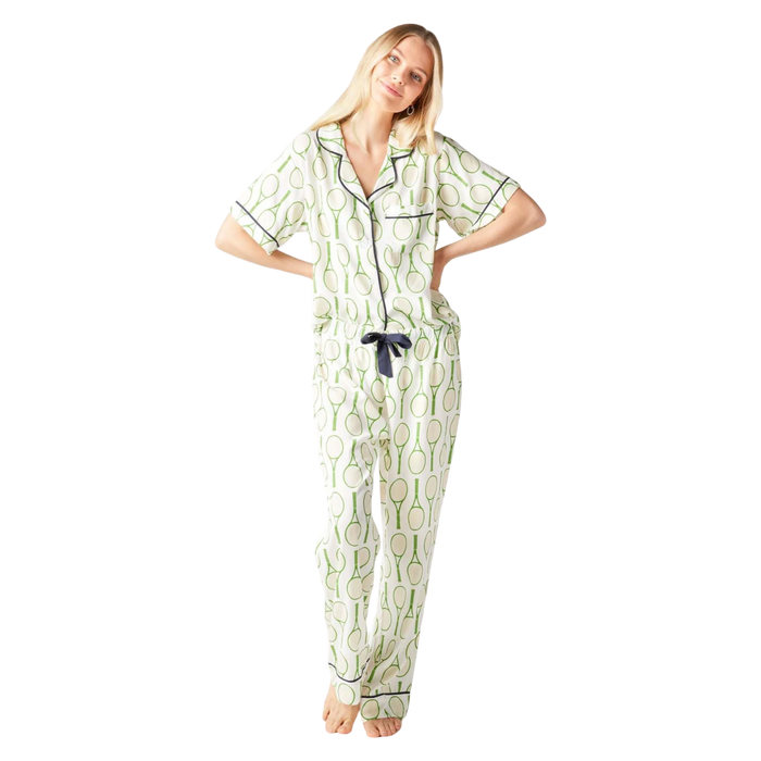 Katie Kime Tennis Time pajama pants set in signature green tennis print with a classic button-down top and relaxed straight-leg pants.