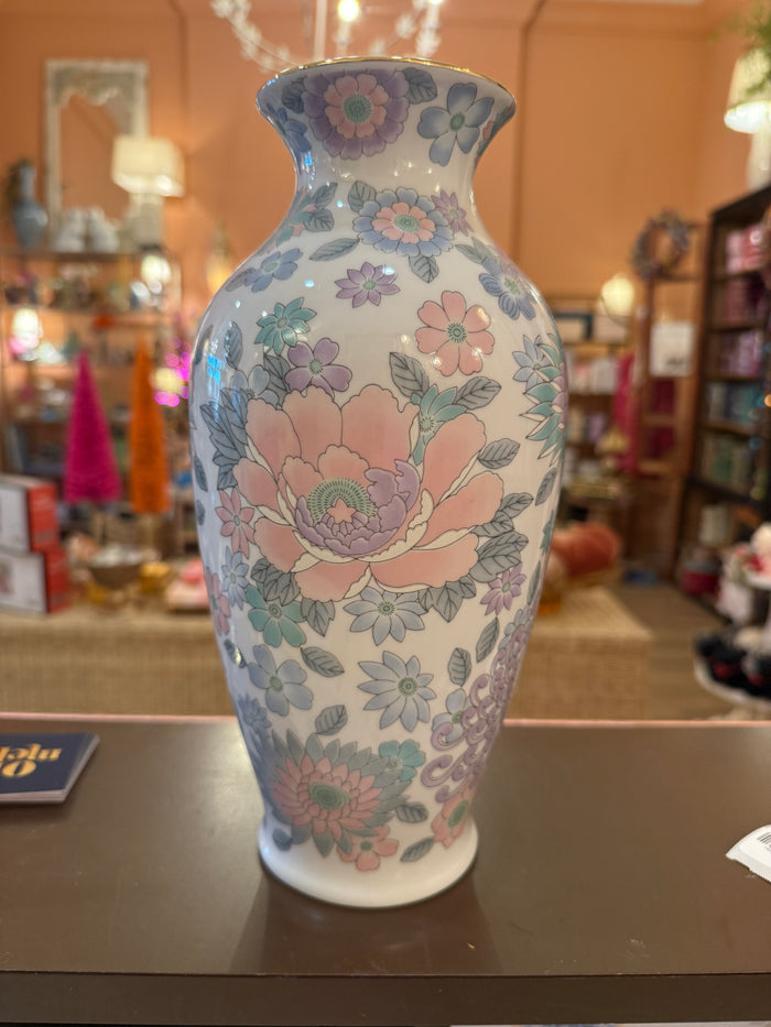Tall porcelain vase with pastel pink, lavender, blue, and mint flowers and a gold-tone rim.
