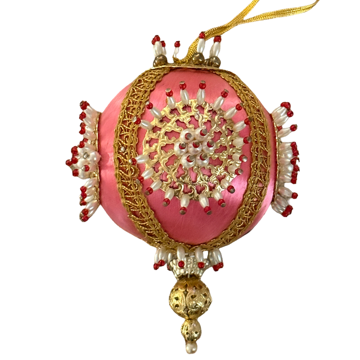 Vintage pink satin-thread ornament with gold-tone medallions, pearl-look beads tipped in red, metallic braid, and an ornate gold-tone drop.