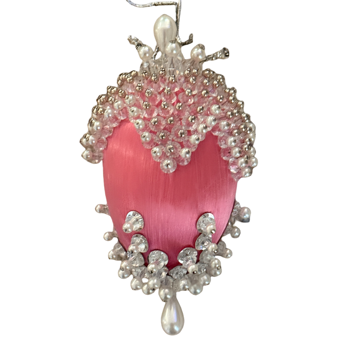 Vintage oval pink satin ornament with scalloped clear beads, pearl-look trim, silver-tone accents, and a teardrop at the base.