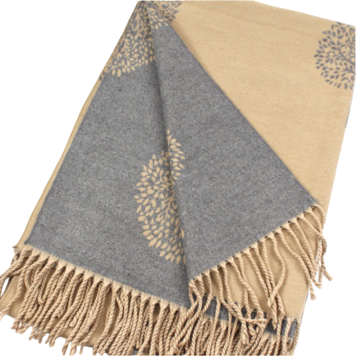 Khaki and gray reversible scarf folded to show contrasting tree motifs on both sides, with khaki fringe at the ends.